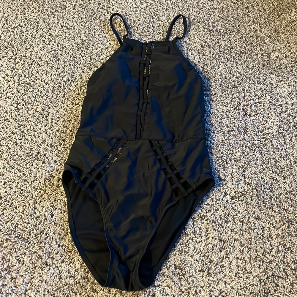 One piece swimsuit with cut out design and open back